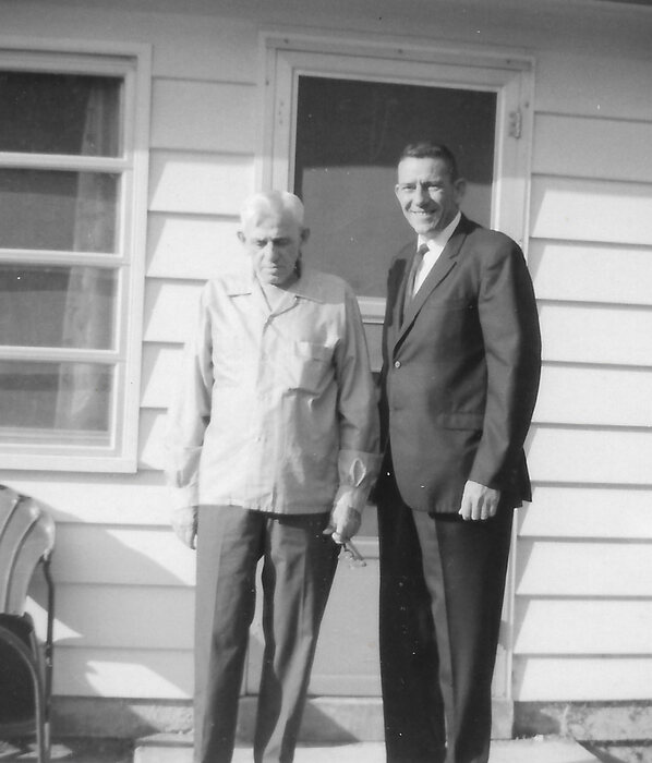 Ed Mooney and his son Lee on the back steps of Ed's home in Belleville, Illinois